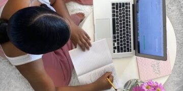 girl working from home with laptop and internet